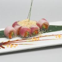 French Crunchy Roll · Hot. Spicy salmon and avocado inside; topped with yellowtail, tuna and panko flakes. Served ...