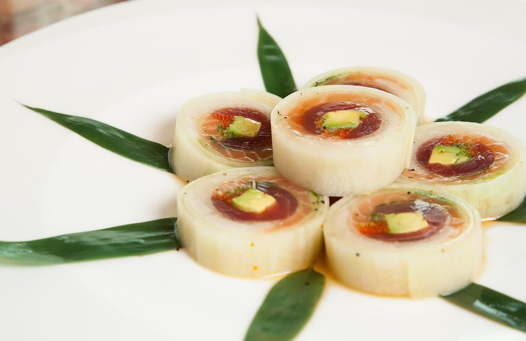 Narudo Roll · Tuna, salmon, white fish, avocado, scallion, tobiko, wrapped in cucumber slices, Served with house ponzu sauce.