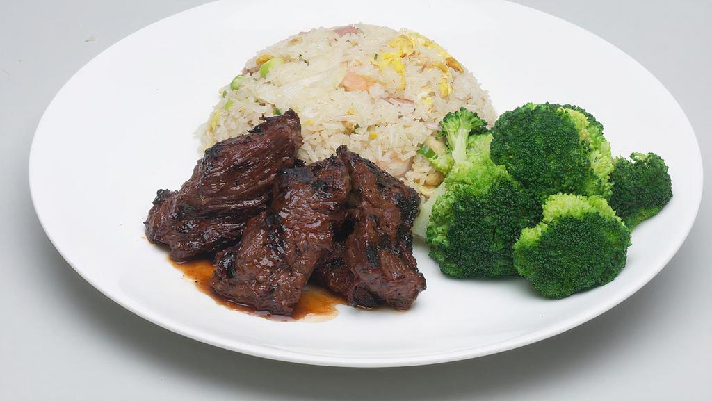 Grilled Sirloin Steak Tips, Pork Fried Rice · Served with steamed broccoli.
