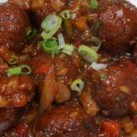 Vegetable Manchurian · Seasonal vegetable dumpling mixed with chili, red onion,  bell peppers sautéed in chili garl...