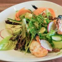 Grilled Shrimp · Grilled shrimp atop mixed greens and served with a light avocado and artichoke lemon dressing