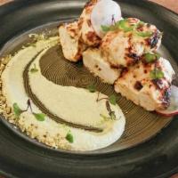 Chicken Malai Tikka · Chicken tenders marinated in cream cheese, grilled in tandoor and garnished with creamy pist...