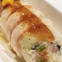 Rodeo Roll · Spicy CA roll topped with shrimp and baked with creamy garlic butter sauce.
