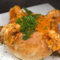 Shrimp And Crab Fondue · Fresh jumbo shrimp and jumbo lump crabmeat in tomato cream sauce, in a bread bowl.