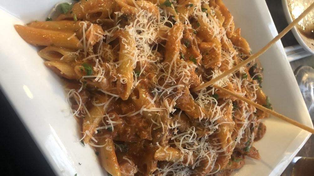 Penne Vodka · Penne pasta sautéed with pancetta, mushroom, and onions in our vodka tomato cream sauce.