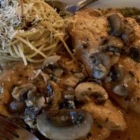 Chicken Marsala · Sautéed with imported marsala wine and topped with mushrooms. Served with spaghetti pasta.