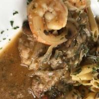 Veal Tuscany · With jumbo shrimp, mushrooms, and onions in a marsala sauce over penne pasta.