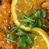 Orange Chicken Rice · Crispy orange chicken over jasmine rice, topped with sesame seeds, cilantro and an orange sl...