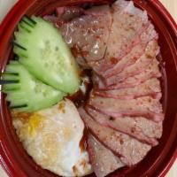 Bbq Pork Rice · BBQ pork over jasmine rice topped with BBQ sauce, cucumbers, and a fried egg