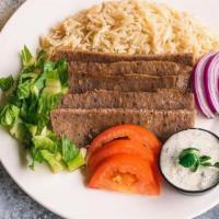 Beef Kafta Kabob · Served with rice,grilled veggies, two oz of tahini and one pita bread.