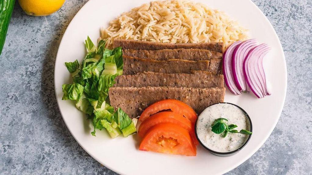 Beef Kafta Kabob · Served with rice,grilled veggies, two oz of tahini and one pita bread.