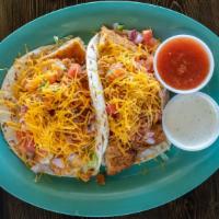 Crispy Chicken Taco · Fried chicken breast, bacon, shredded lettuce, fresh pico, and cheddar cheese stuffed in 2 t...