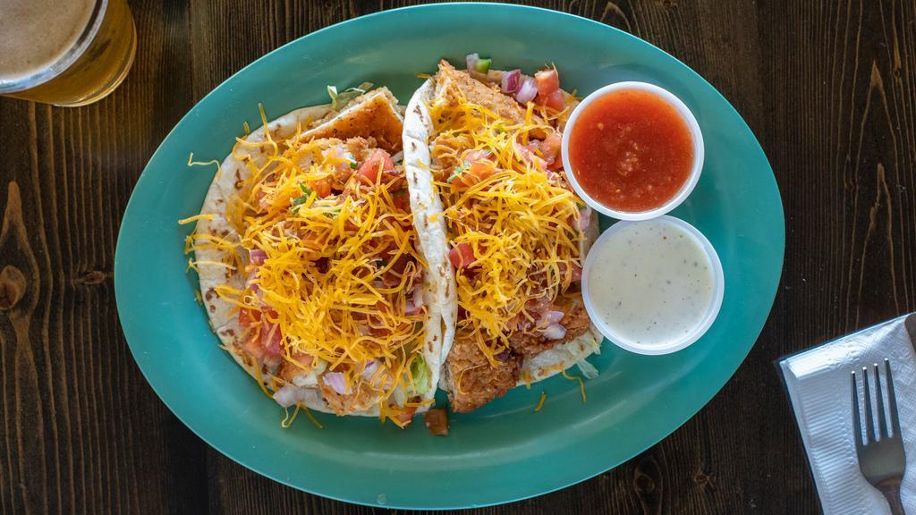 Crispy Chicken Taco · Fried chicken breast, bacon, shredded lettuce, fresh pico, and cheddar cheese stuffed in 2 tortillas. Served with sides of ranch and homemade salsa.