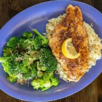Cajun Catfish · Juicy blackened catfish filet served over a bed of spicy rice with one additional side item.