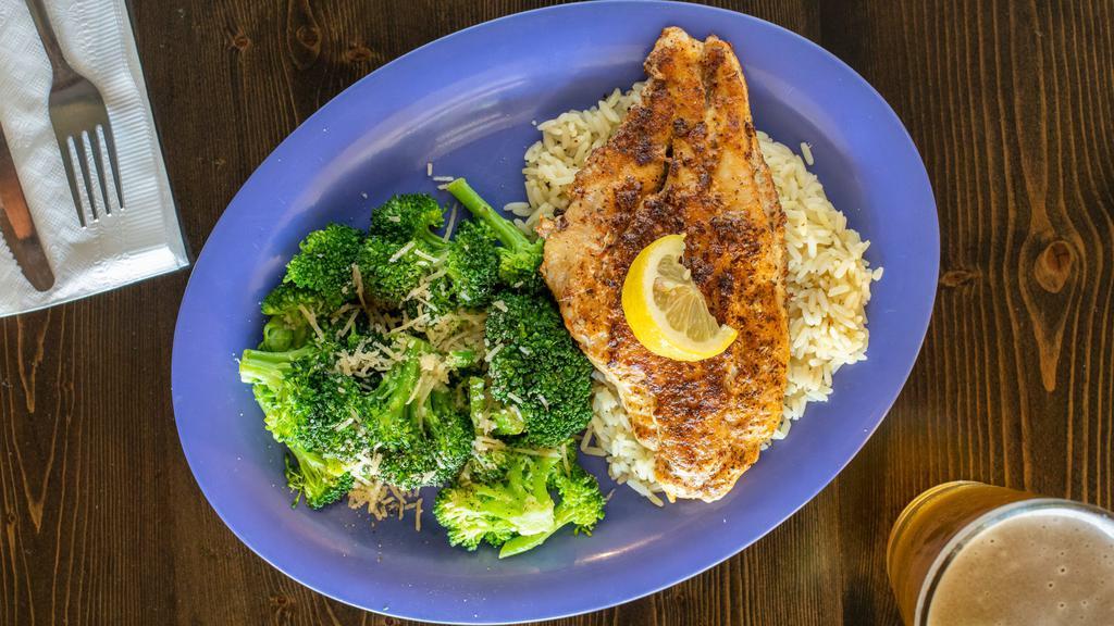 Cajun Catfish · Juicy blackened catfish filet served over a bed of spicy rice with one additional side item.