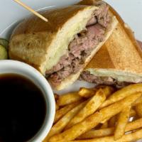 Prime Rib Dip · Sliced prime rib & melted Swiss on a long roll or a wrap & a side of au jus.