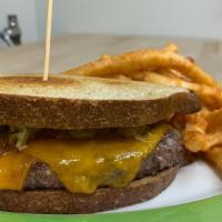 Patty Melt  · Sautéed onions & cheddar cheese pressed together between buttered & grilled rye bread.