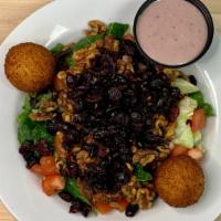 Goat Cheese Salad · Panko-crusted goat cheese, walnuts, tomatoes, cranberries & mixed greens; served with a side...