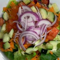 House Salad · Mixed greens, carrots, onions, cucumbers & tomatoes; served with a side of  dressing.