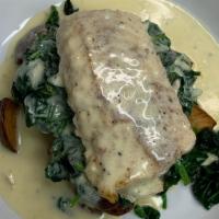 Shamrock Cod · Pan seared & topped with an Irish parsley cream sauce; served over sauteed spinach & roasted...