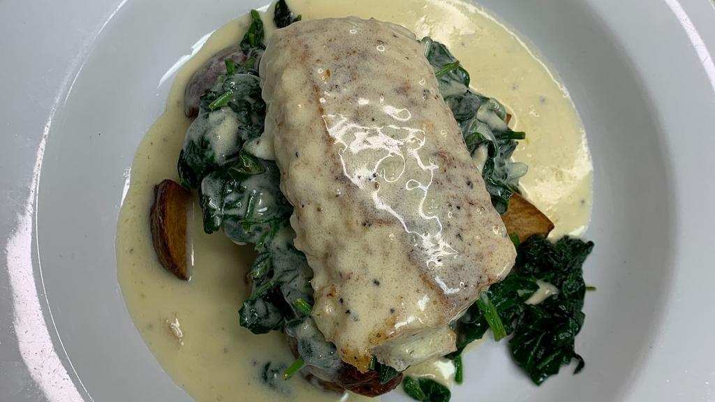 Shamrock Cod · Pan seared & topped with an Irish parsley cream sauce; served over sauteed spinach & roasted potatoes