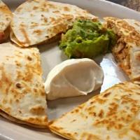 Quesadilla Platter · 3 flour or corn quesadillas with sour cream and guacamole.