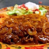 Ord Lomo En Chile De Arbol · Ribeye with grilled onions Simmered in a Spicy Salsa