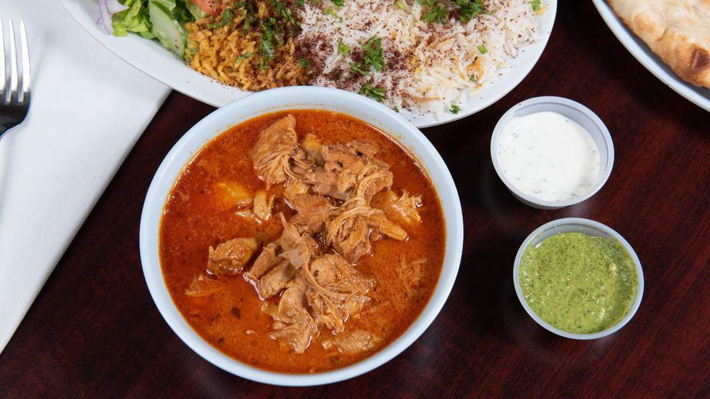Butter Chicken · Butter chicken, basmati rice, small salad and naan bread.