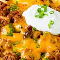 Chili Cheese Fries · House-made angus beef chili, colby-jack cheese, green onions.