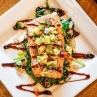 Blackened Salmon · Served over sautéed spinach topped with our pineapple salsa and a balsamic reduction.
