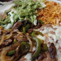 Fajitas Express · Our version of tender slices of beef or chicken grilled with onions and bell peppers. Served...