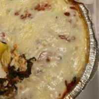 Baked Ravioli · With cheese, meat or sauteed spinach topped with marinara, Romano, parmesan and mozzarella c...
