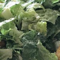Caesar Salad · Fresh crisp romaine lettuce, romano cheese, creamy Caesar dressing, croutons.