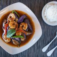 Spicy Eggplant · Sautéed meat with eggplants, basil, bell peppers, and onions in chili light bean sauce. Serv...