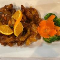Paradise Chicken · Deep-fried chicken, stir-fried with oranges, onions, carrots, and peas in homemade orange sa...