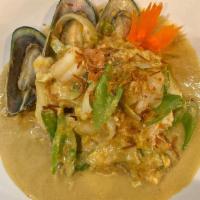 Seafood Curry · Shrimp, squid, scallops, and mussels stir-fried with onions, scallions, celery, and eggs in ...
