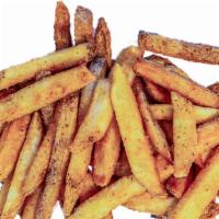 Fries · Thick-cut fries dusted with salt and pepper.