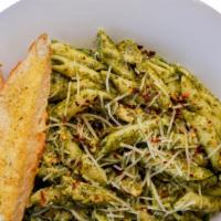 Pesto Penne · Penne in basil pesto with garlic grilled chicken, parmesan, and red pepper.