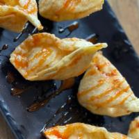Hillbilly Wontons · Our country version of crab ragoons! 6 crispy wontons stuffed with creamy jalapeno pimento c...