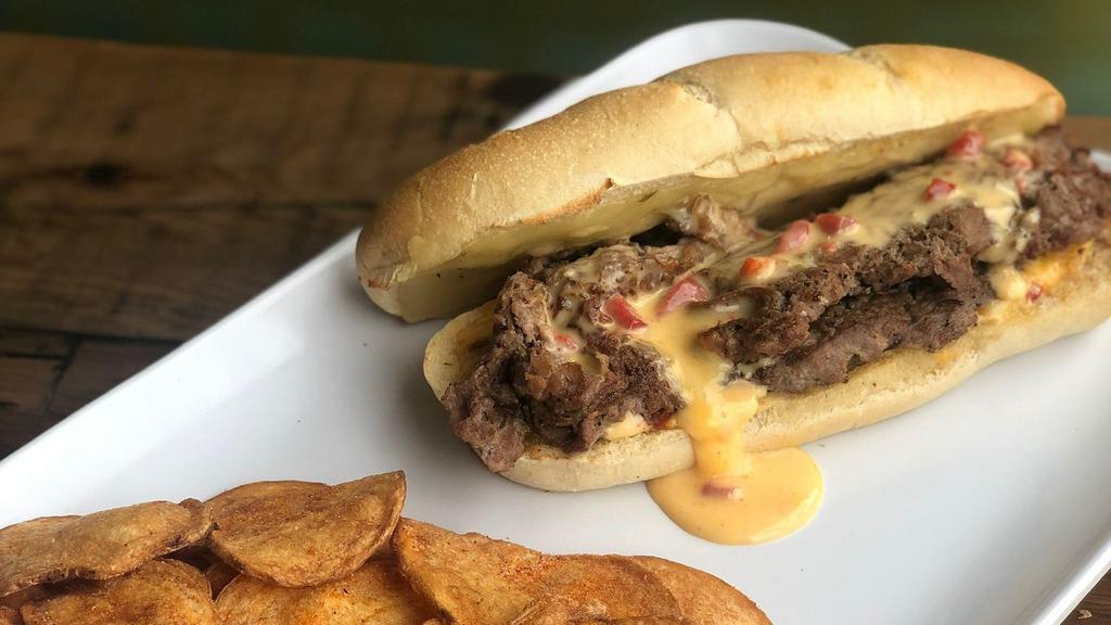 901 Cheese Steak Sandwich · Certified Angus sirloin, sautéed onions, pepper Jack cheese, and pimento cheese sauce on a toasted french roll. Comes with a pickle spear and your choice of a side.