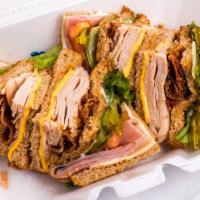 Club Sandwich · Honey ham, turkey, bacon, cheese, lettuce, tomato, pickles and mayo served on 3 pieces of to...