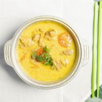 Grandma'S Curry · Slowed cooked chicken curry, carrots and onions in a clay pot. Served with your choice of br...