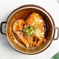 Fish In A Clay Pot · Your choice of bone-in catfish or tilapia simmered in a traditional sauce and sprinkled with...