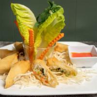 Egg Rolls · Fried vegetarian rolls of cabbage, celery, carrot, glass noodle served with sweet and sour s...