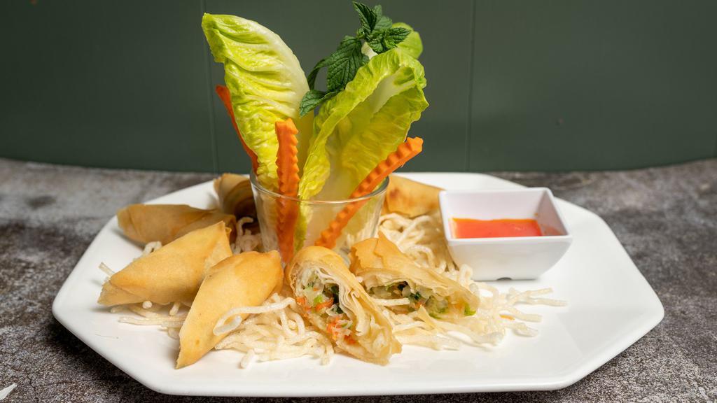 Egg Rolls · Fried vegetarian rolls of cabbage, celery, carrot, glass noodle served with sweet and sour sauce.