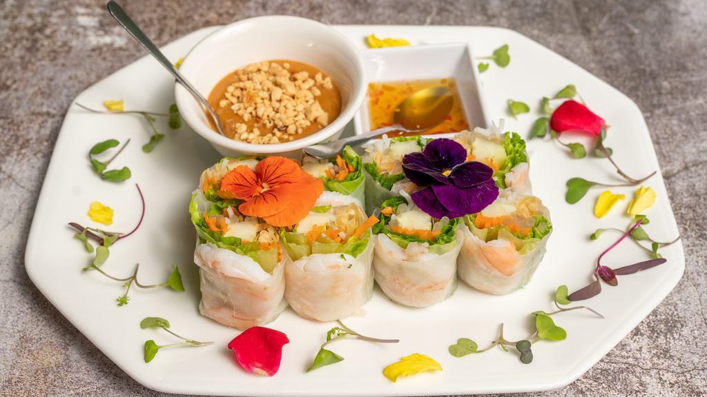 Fresh Spring Rolls · Lettuce, cucumber, mint and rice noodle, fried wonton skin wrapped in rice paper. Served with peanut sauce topped with crushed peanuts and chili paste.