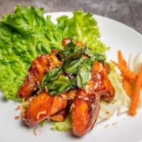 Angel Wings · Deep fried chicken wings with house special spicy sauce topped with crispy thai basil.