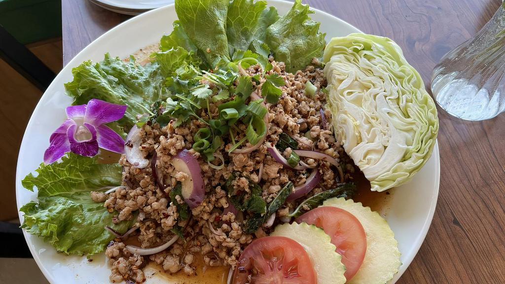 Larb · Minced chicken or pork tossed with spicy lime dressing red onions, dried chili and a touch of rice powder.
