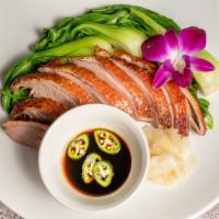 Honey Roasted Duck · Roasted duck breast, steamed bok choy topped with honey served with house sauce.