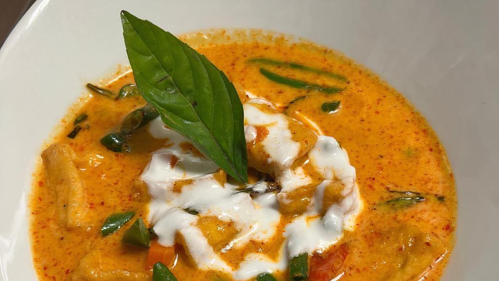 Panang Curry · Coconut milk, green bean, pea and carrot, bell pepper and sweet thai basil in panang curry sauce.